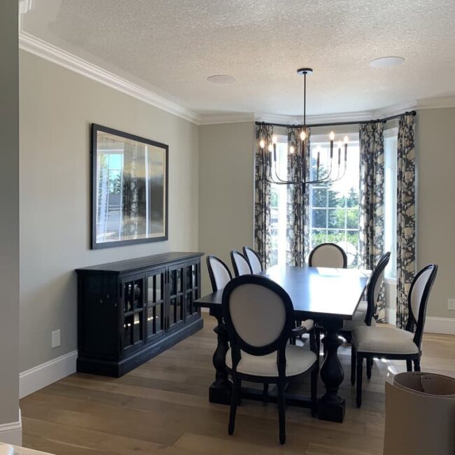 a dining room with a table and chairs