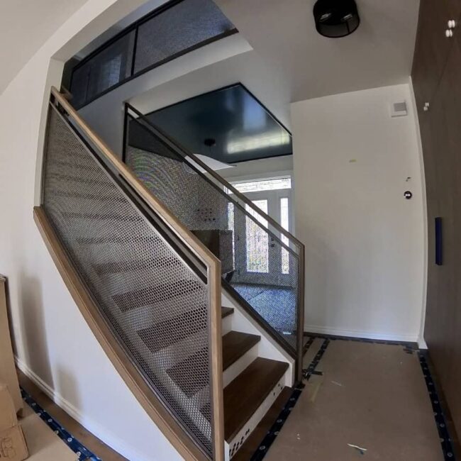 staircase with metal railings