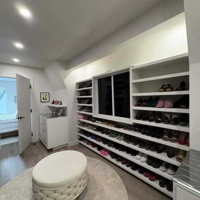 open concept closet with many shoes