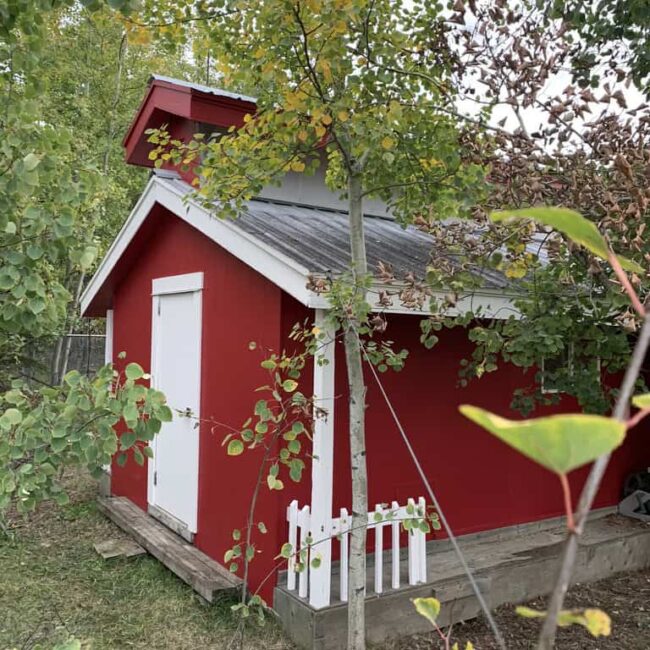 shed painted with red siding and white
