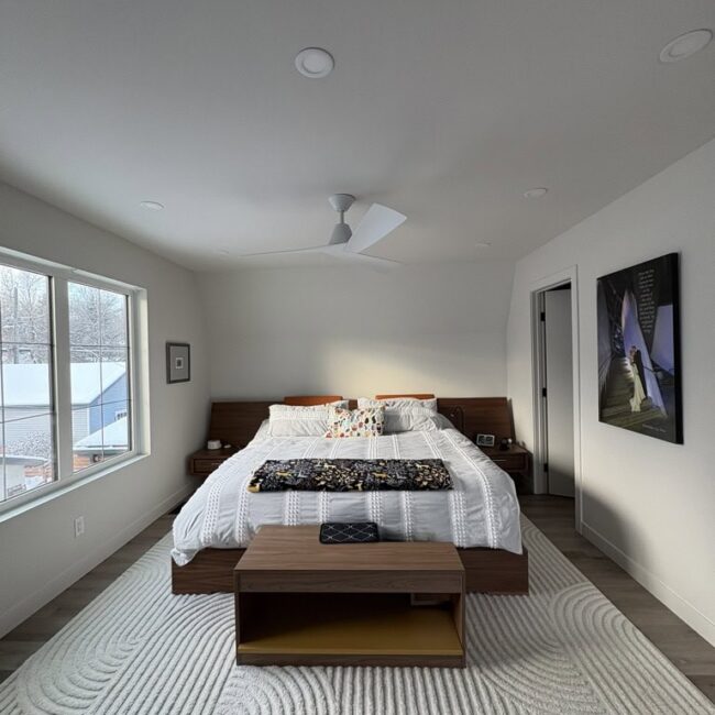 Bedroom with white walls and trim