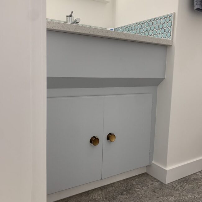 light blue cabinet in a washroom