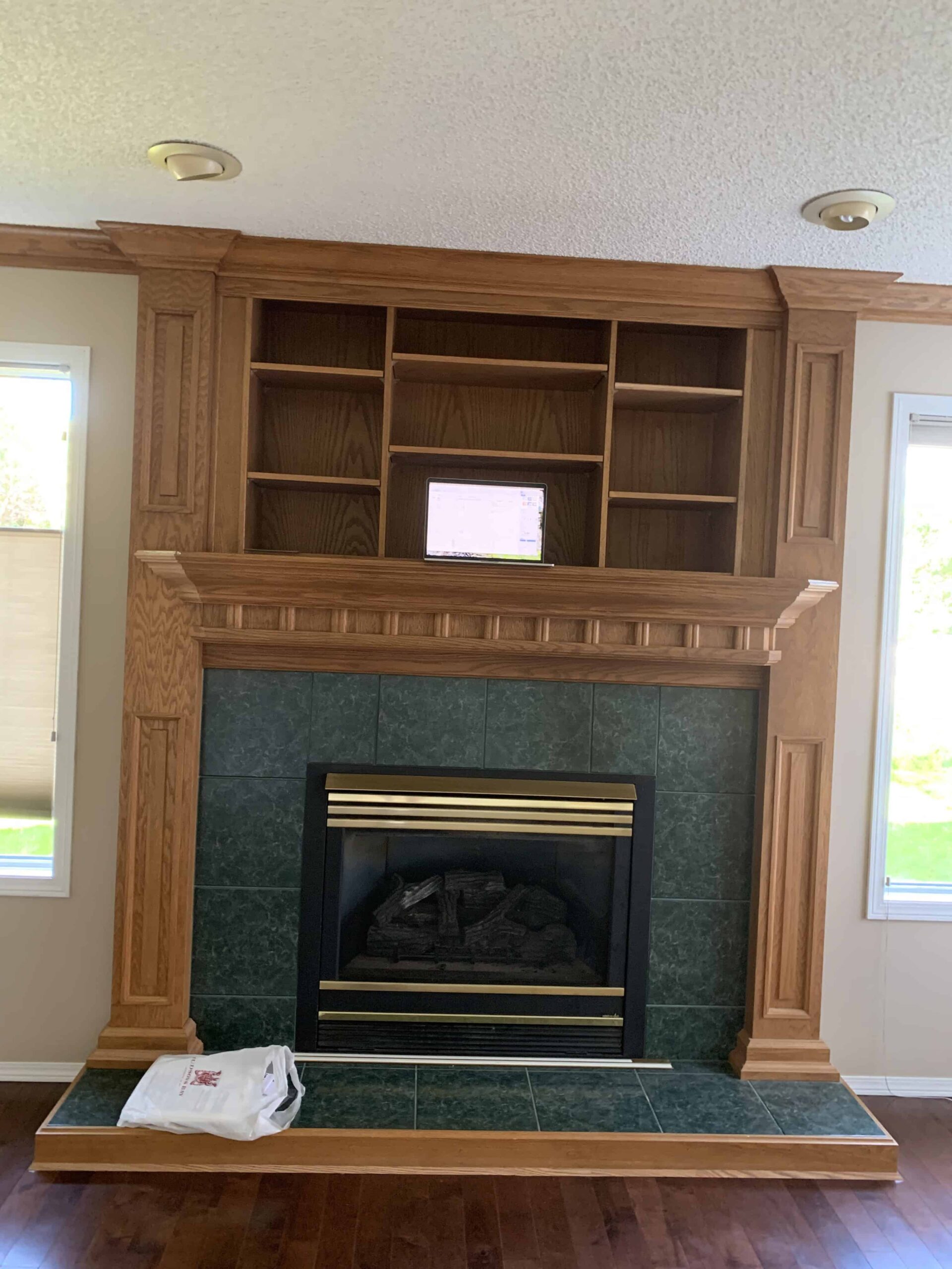 a fireplace with shelves above it