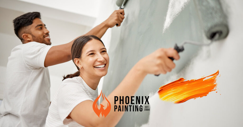 a woman painting a wall with a paint roller