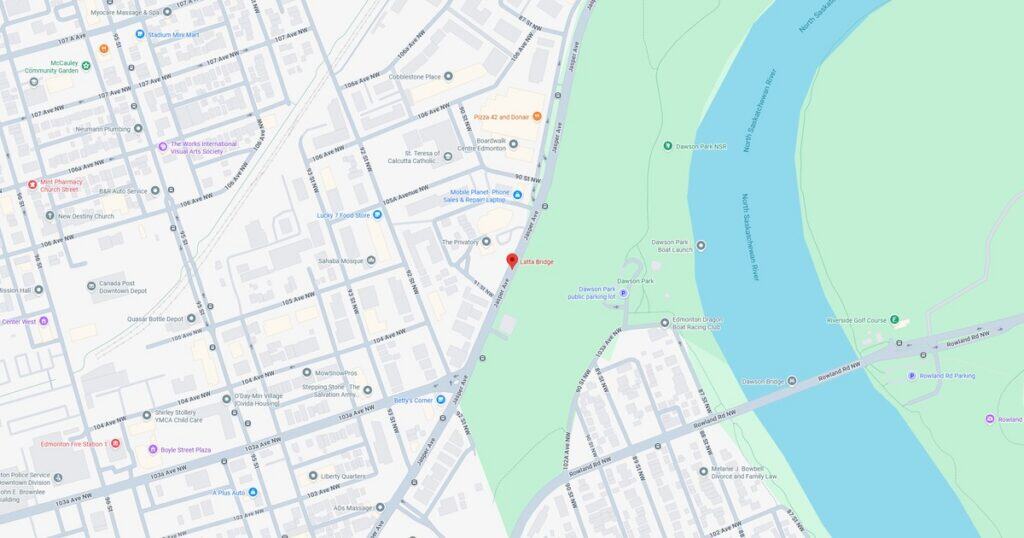 Map showing riverfront park, walking trails, and nearby streets in the city.